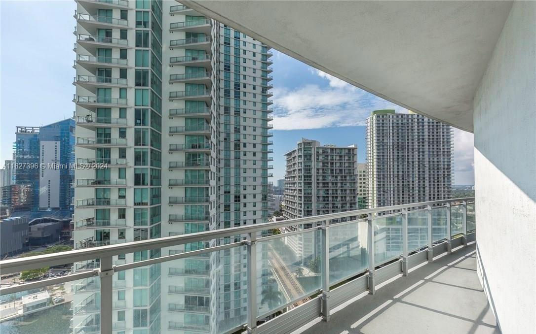 a view of balcony with a floor to ceiling window and balcony