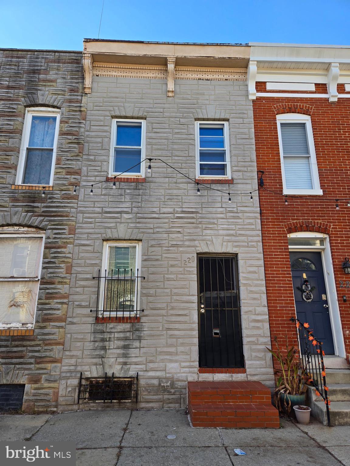 a front view of a building with brick walls