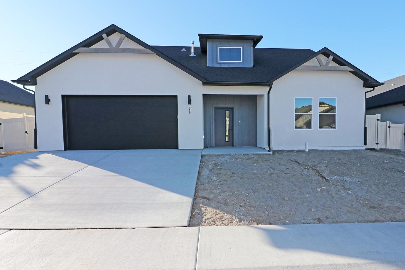 a front view of a house with a garage