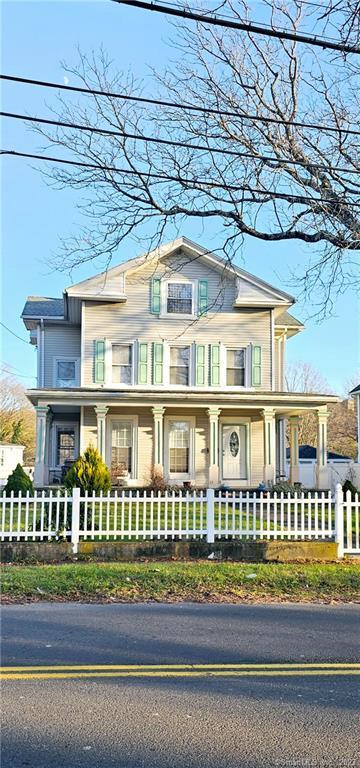 a front view of a house with a porch