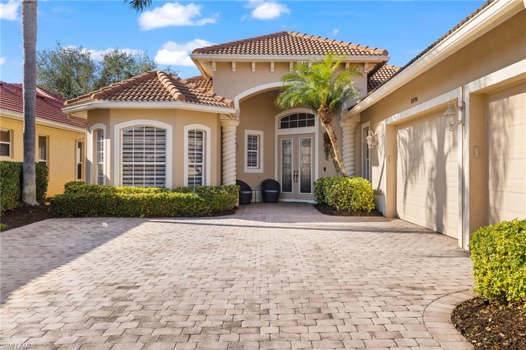 Entrance to property with french doors and a garage