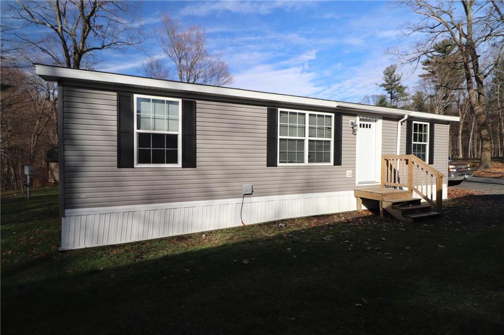 a front view of a house with yard