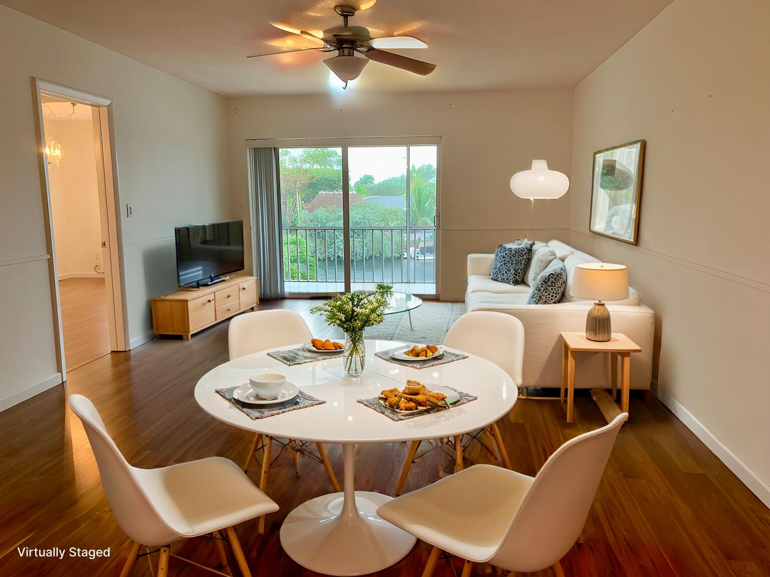 a view of a dining room with furniture and wooden floor