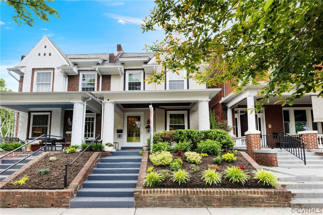 a front view of house with yard and green space