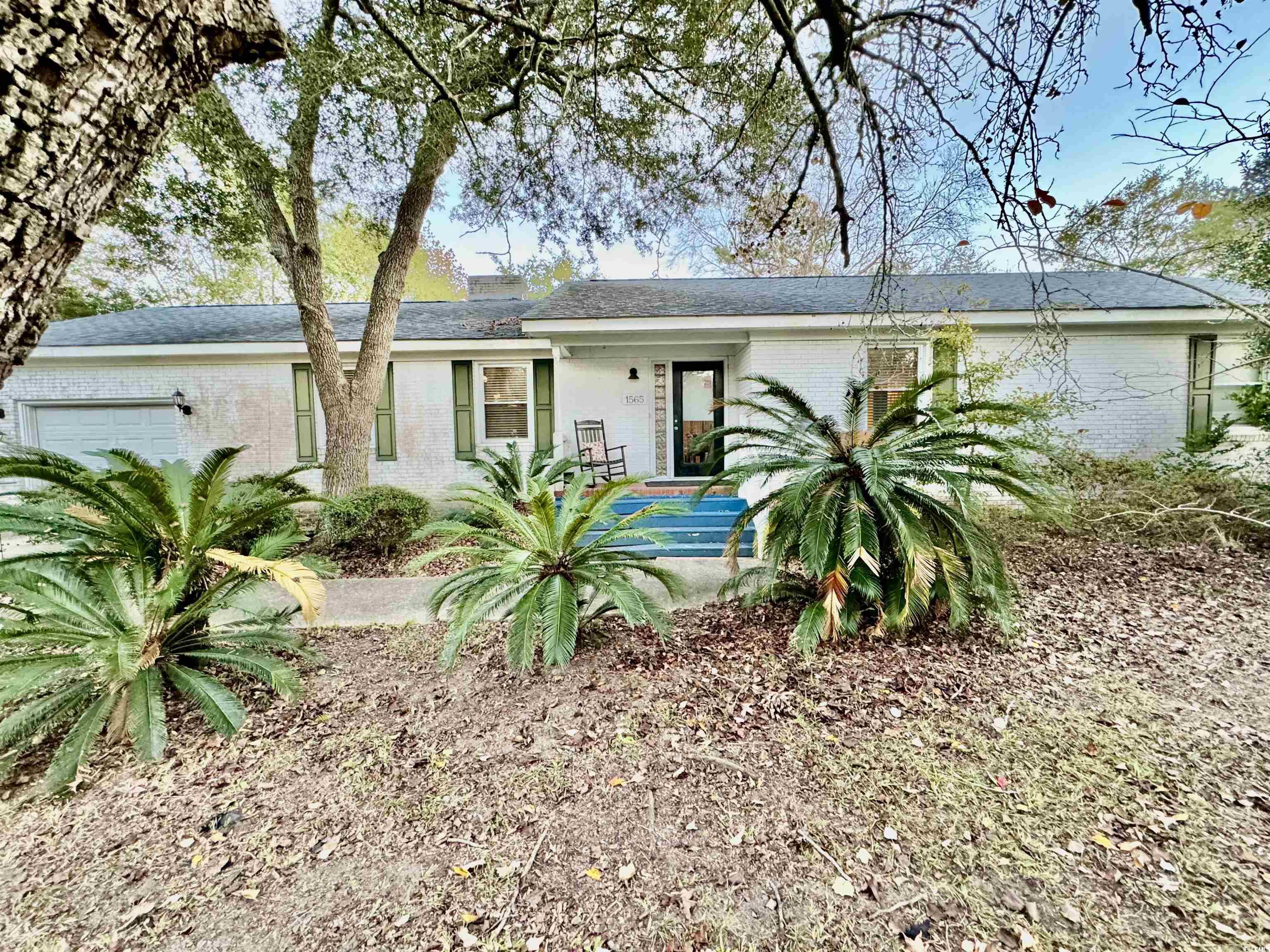 Single story home featuring a garage