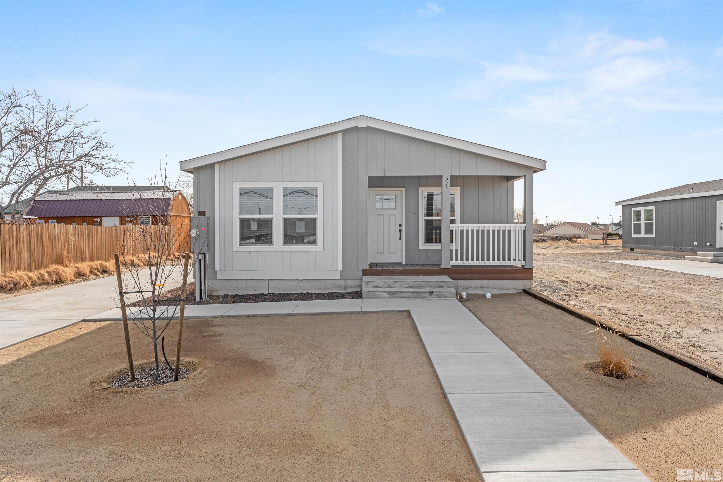 a view of a house with backyard sitting area and tub