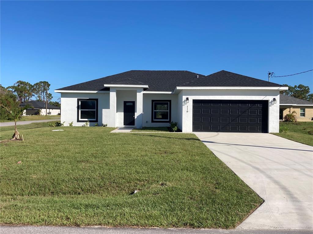 a front view of a house with a yard