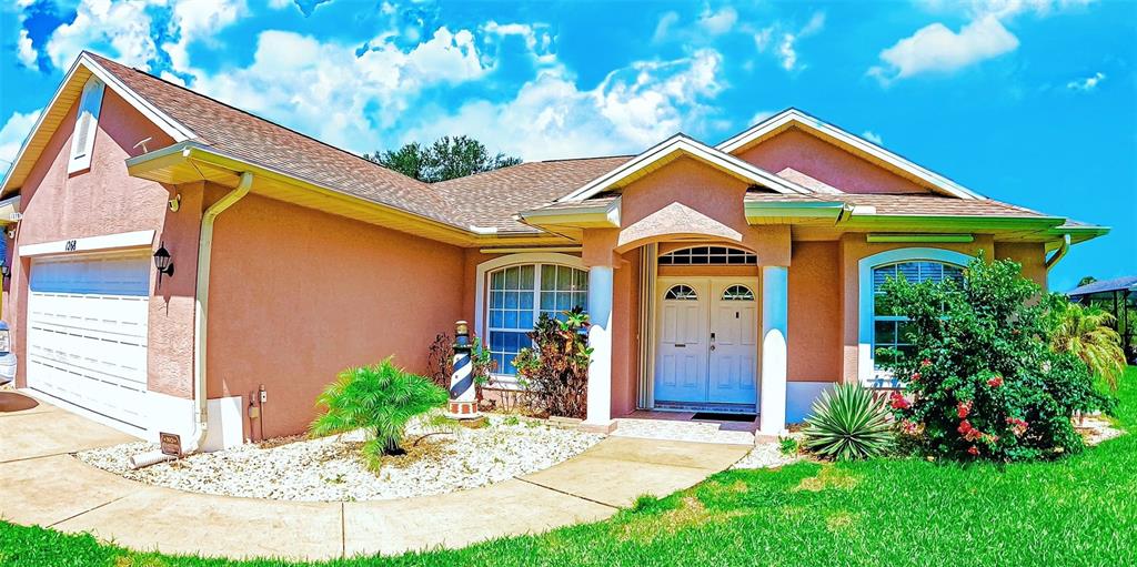 a front view of a house with a yard