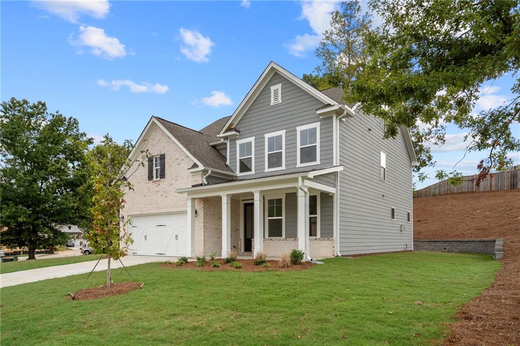 a front view of a house with a yard