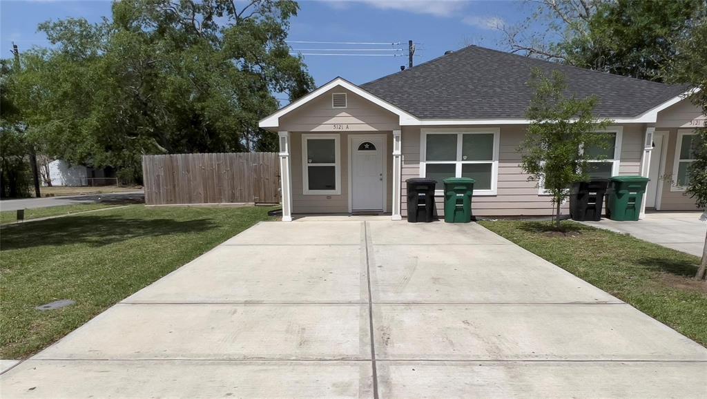 a front view of a house with a garden and porch