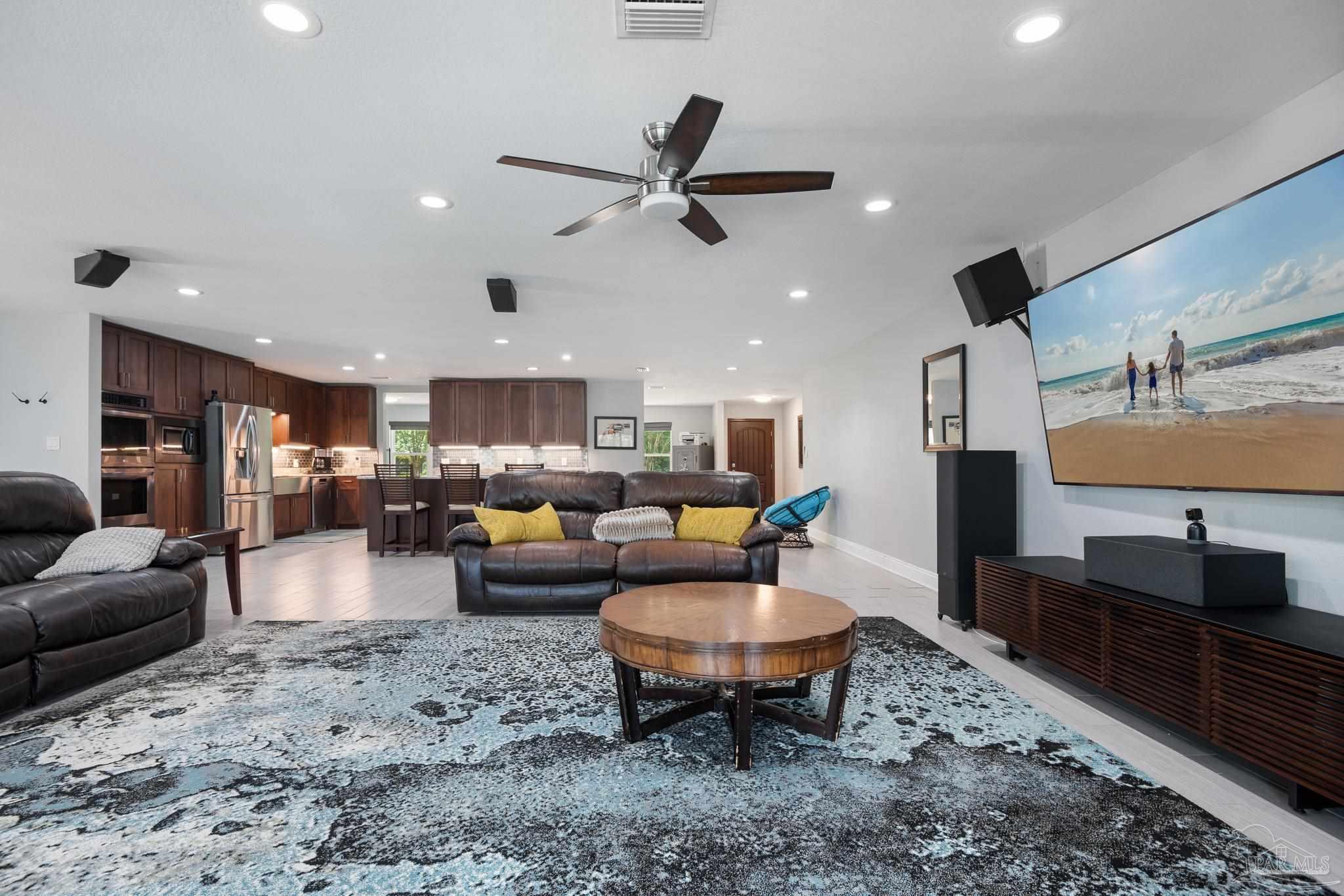 a living room with furniture and a rug