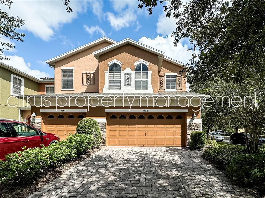 a front view of a house with garage and garage