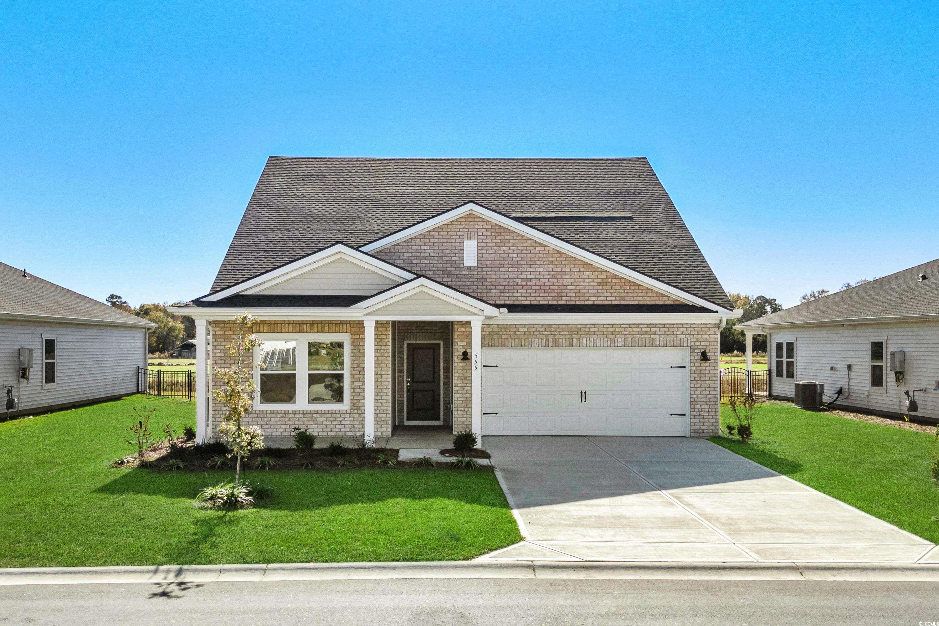 View of front of house featuring a garage, a front