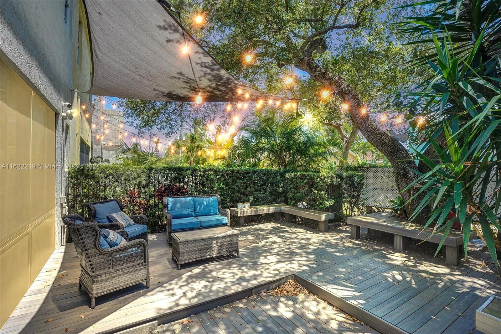 a view of outdoor sitting area with furniture