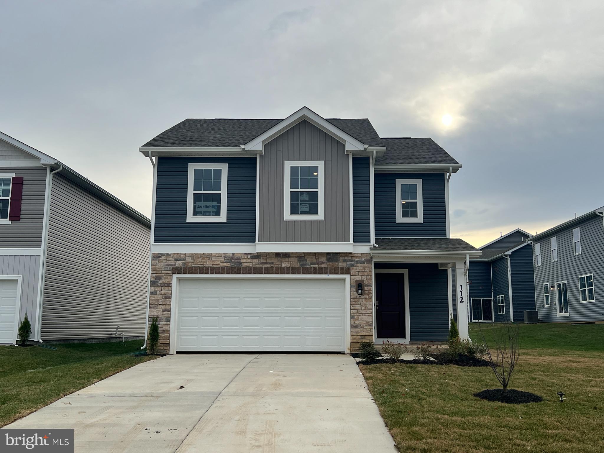 a front view of a house with garage