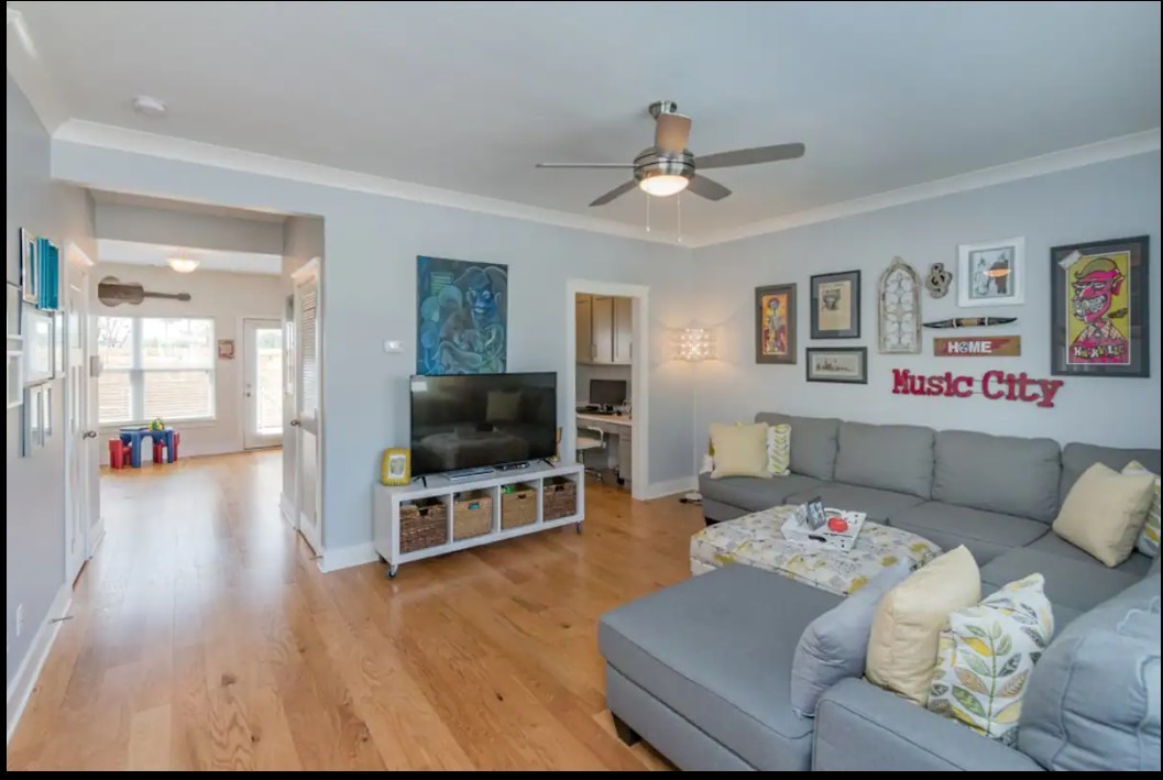 a living room with furniture and a flat screen tv