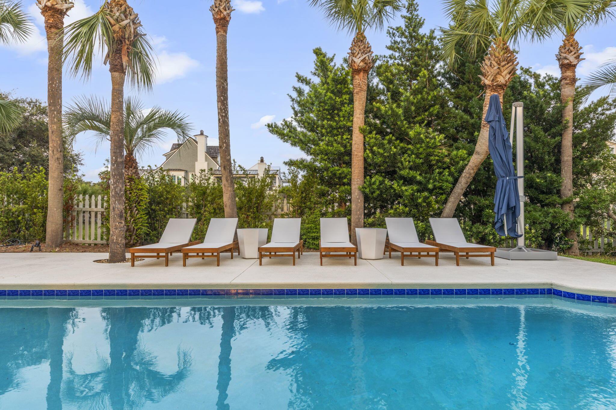 a view of a swimming pool with a table and chairs