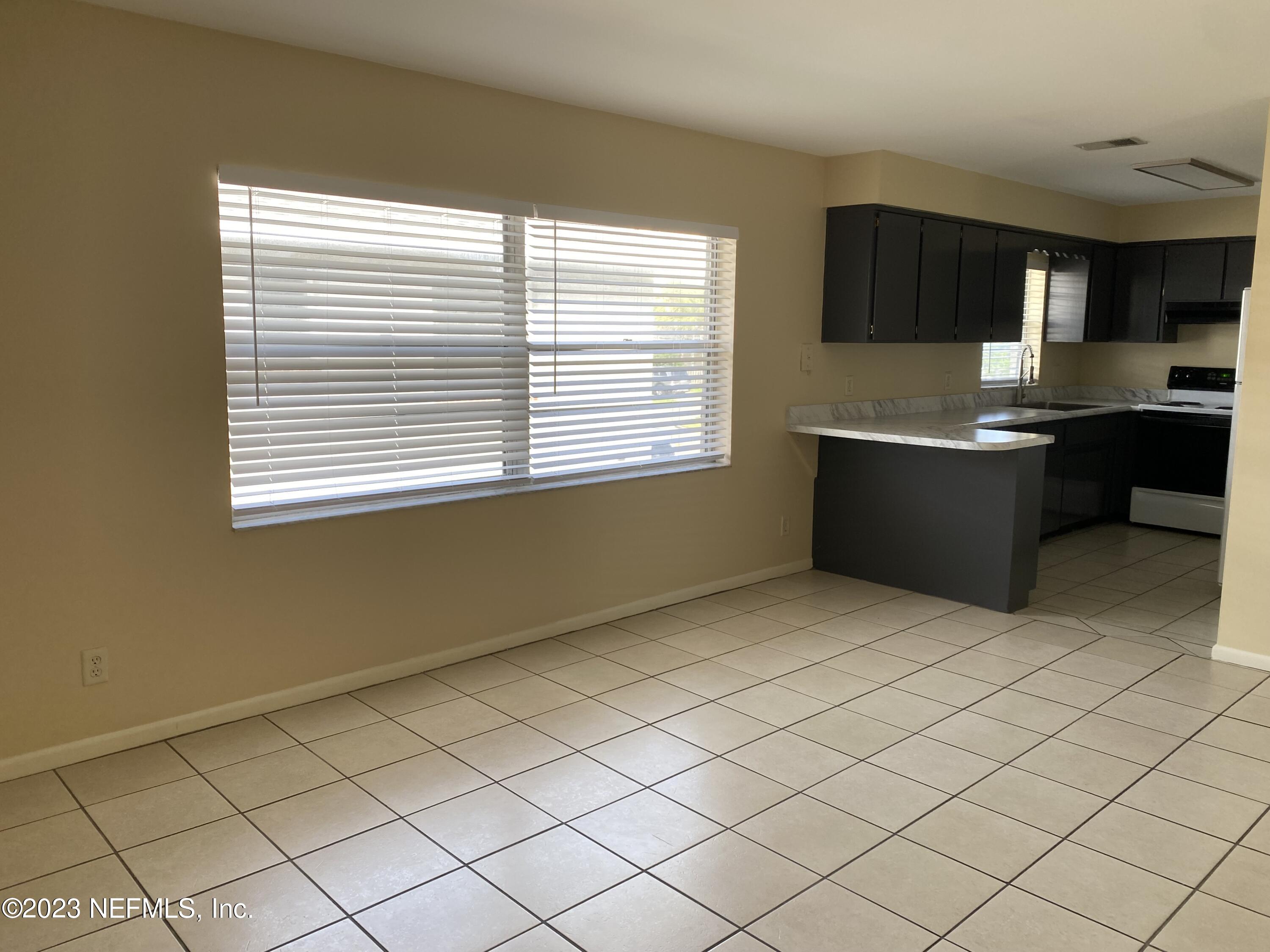 a kitchen with stainless steel appliances granite countertop a sink and a stove