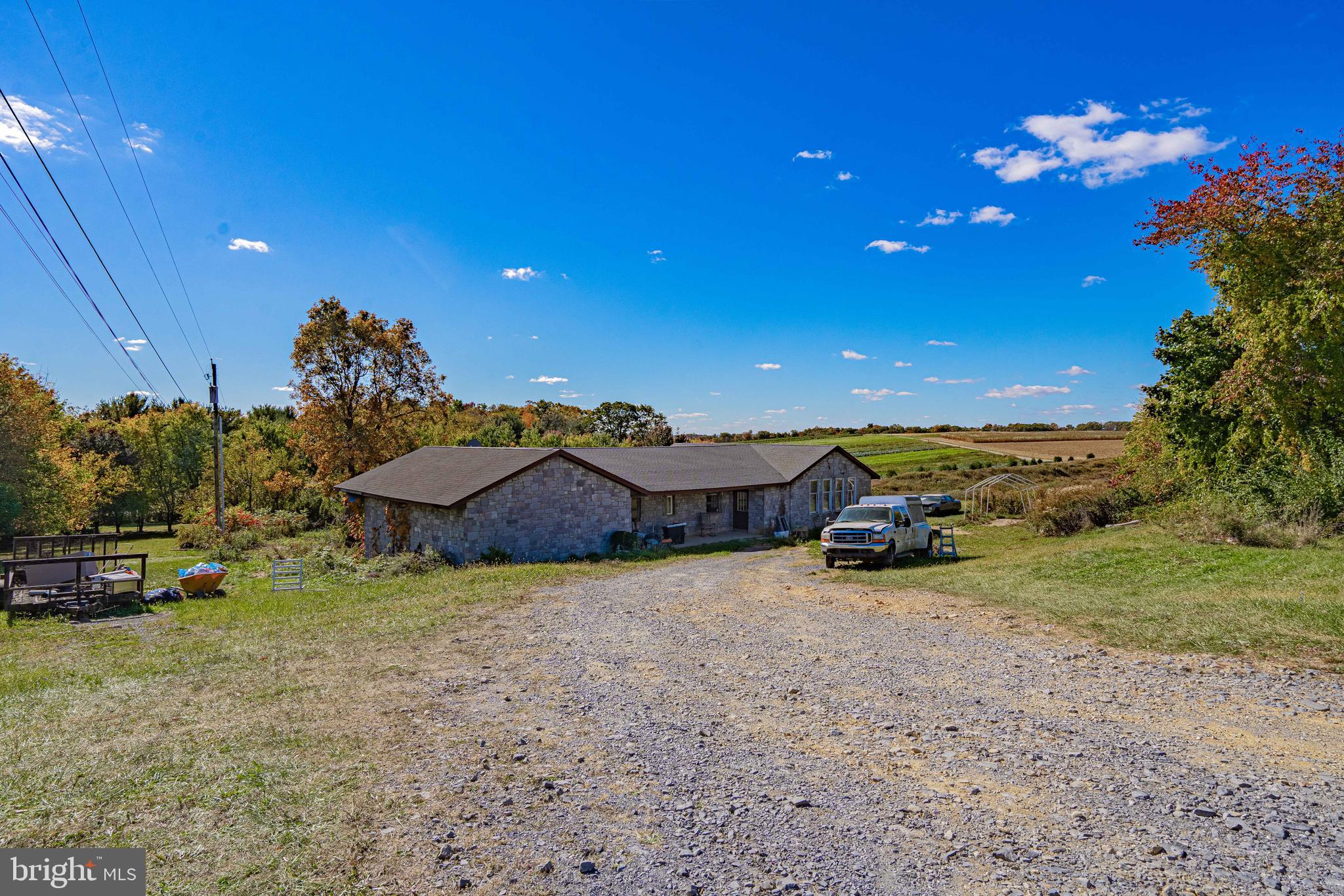 a view of a house with a yard and pool