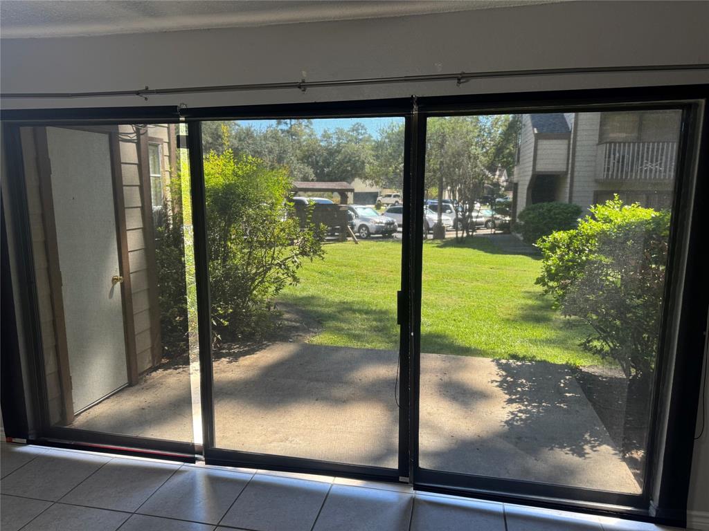 a view of a glass door of the house