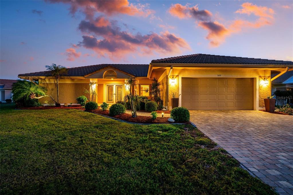 a view of a house with a backyard