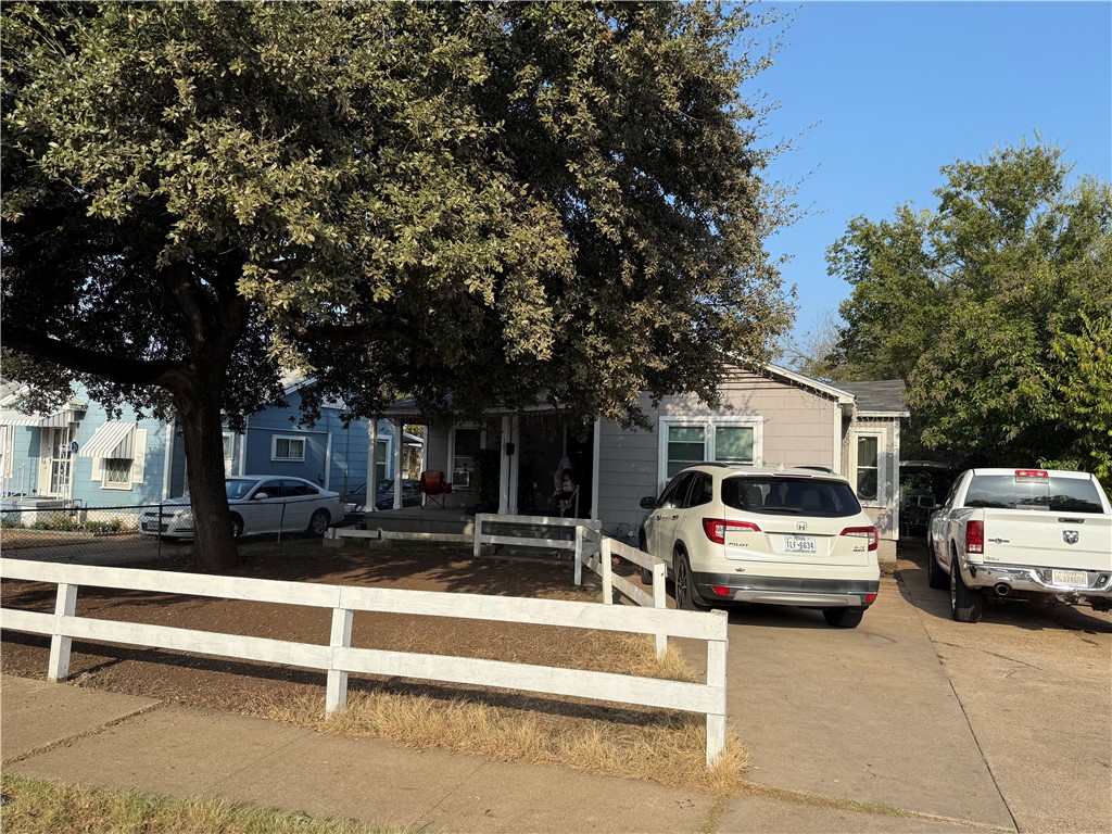 a view of car parked in front of house