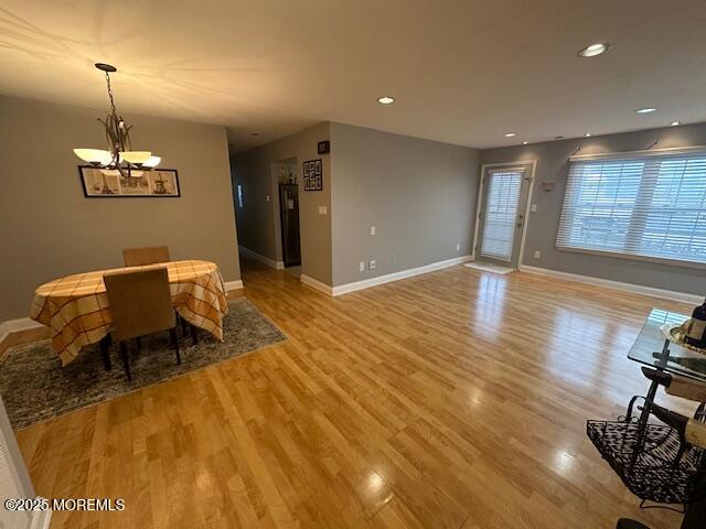 a view of a room with furniture and chandelier