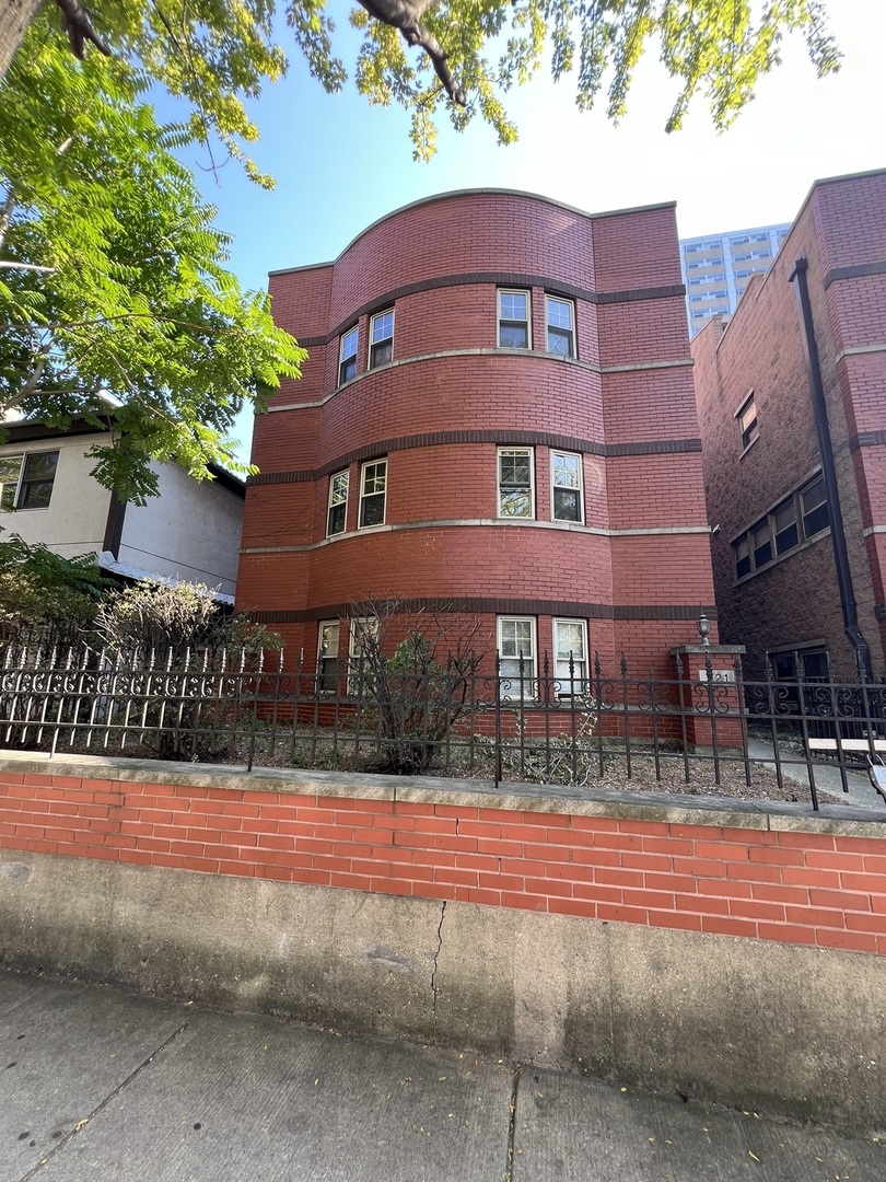 a view of a building with a street