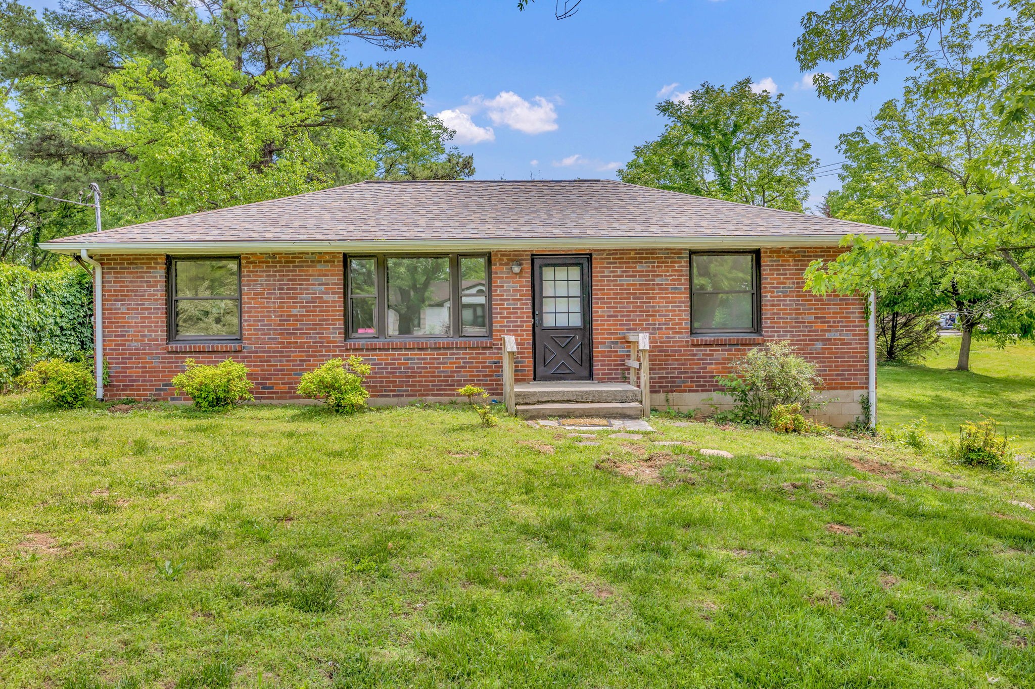 a front view of a house with garden