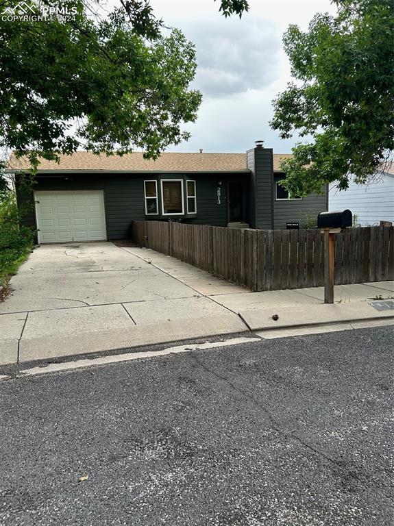 View of front of home featuring a garage