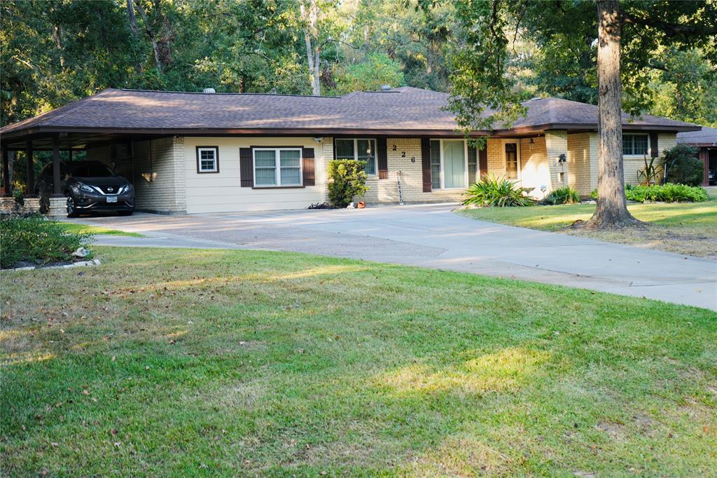 Front of Home w/Spacious Parking & Covered Carport