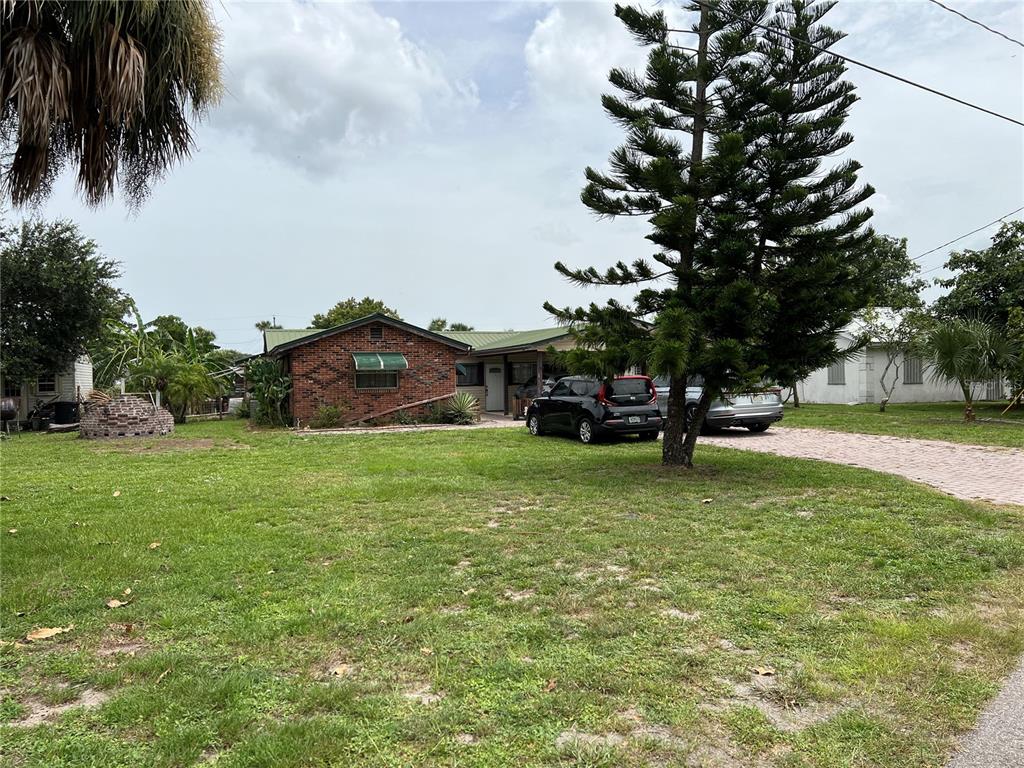 a view of a house with a big yard