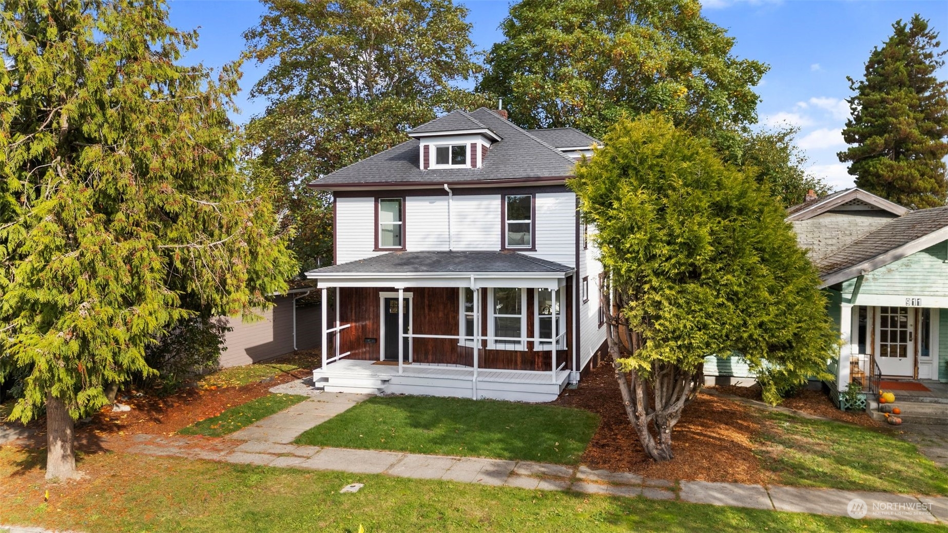 a front view of a house with a yard