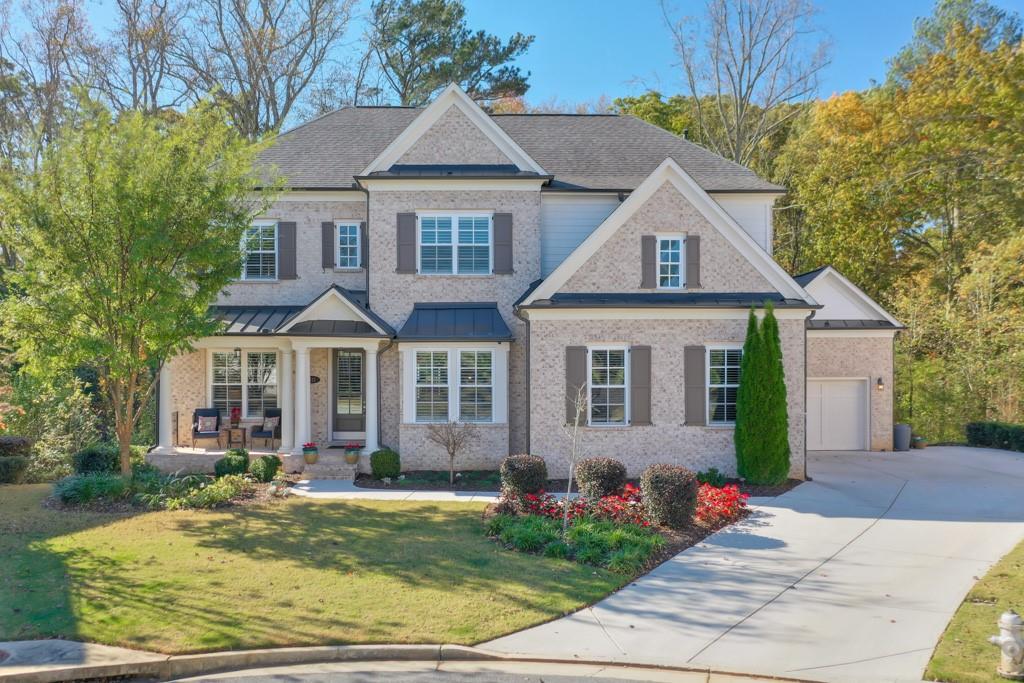 front view of a house with a yard