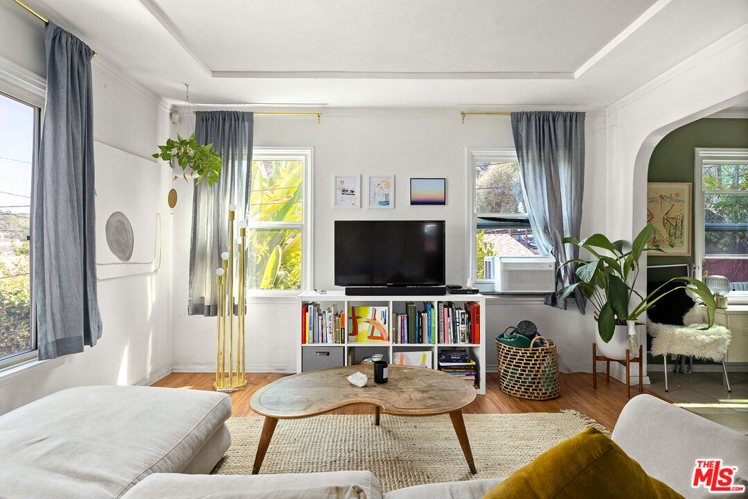 a living room with furniture and a flat screen tv