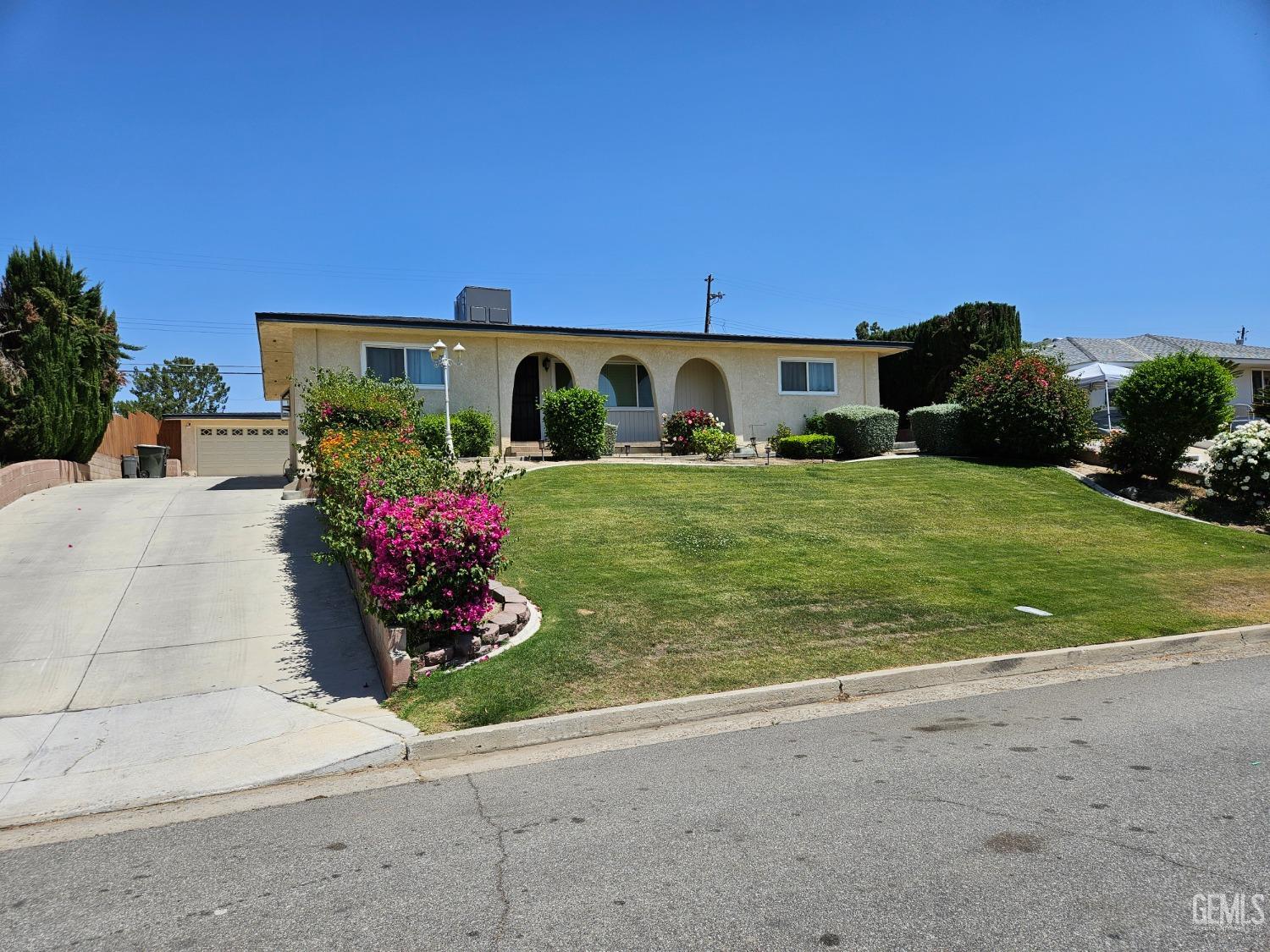 a front view of house with yard and outdoor seating