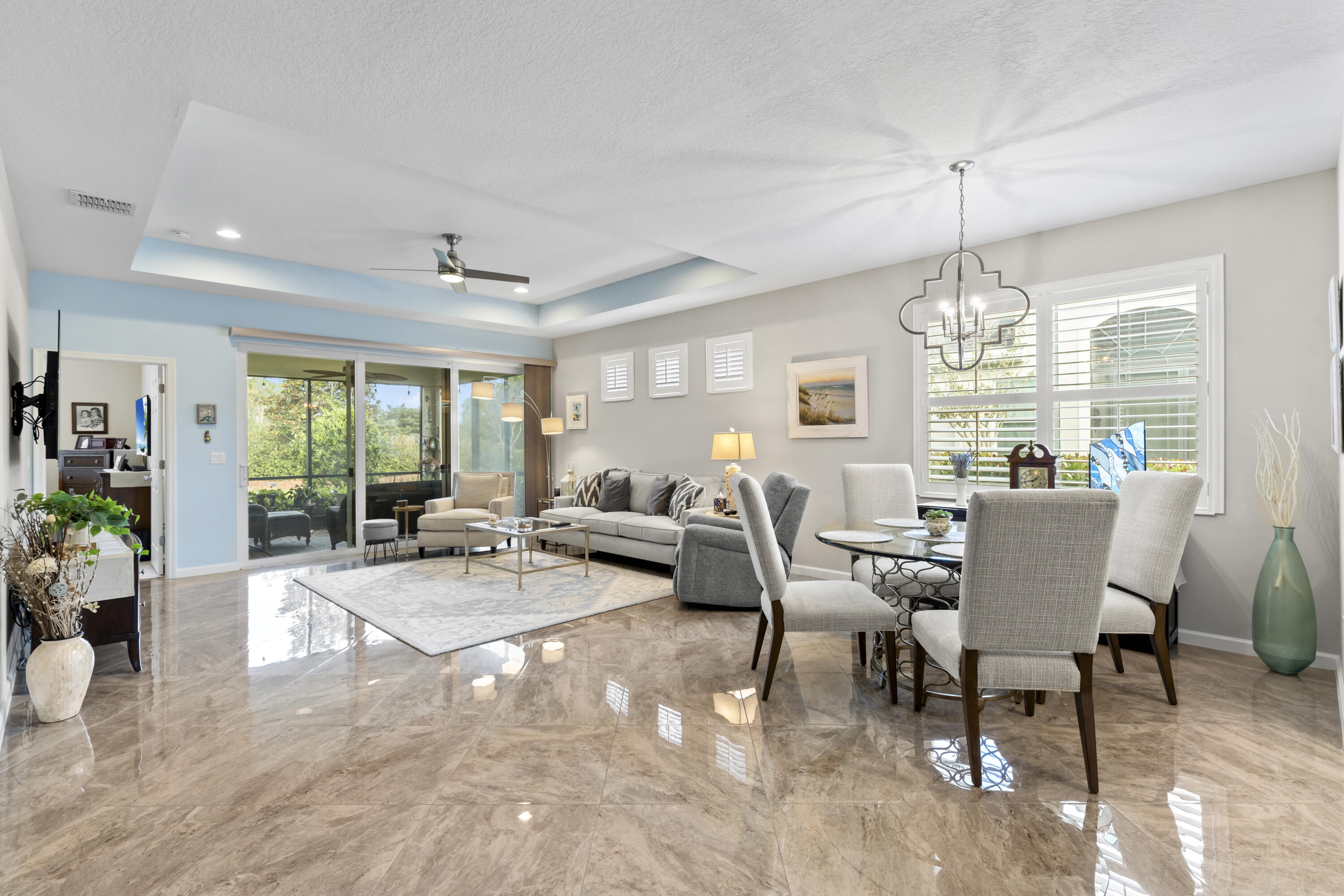 a living room with furniture chandelier and a chandelier