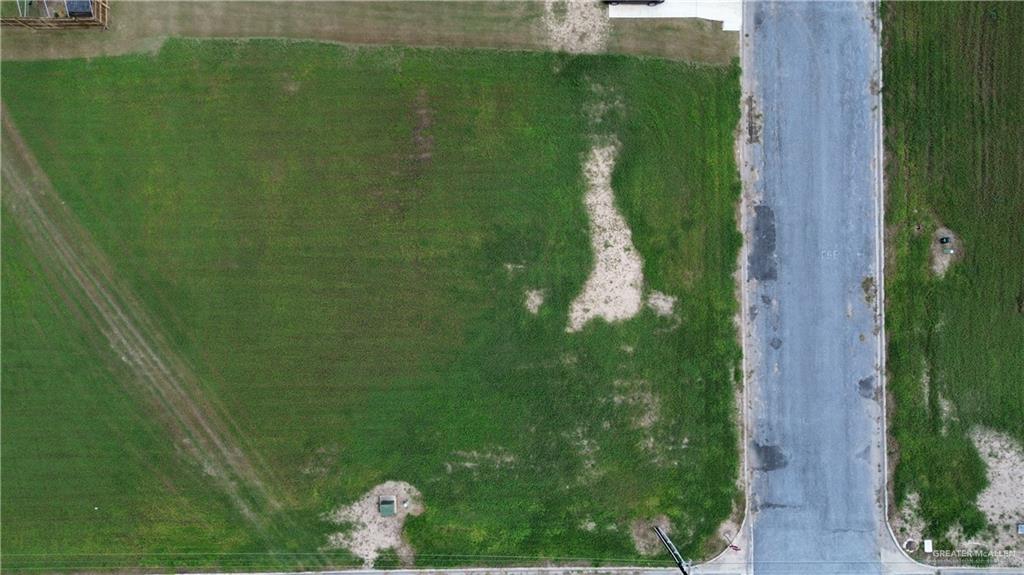 Birds eye view of property with a rural view