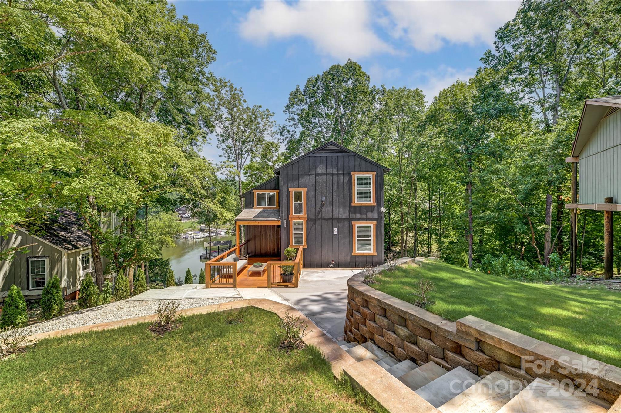 a view of a house with a yard patio and a garden