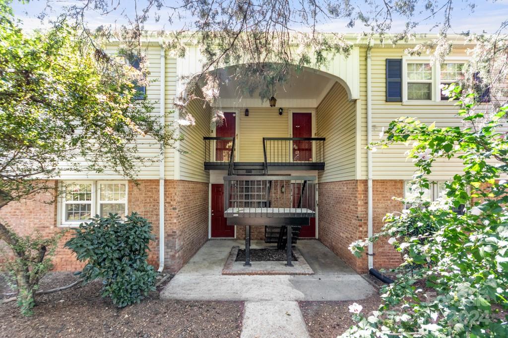 a front view of a house with chairs