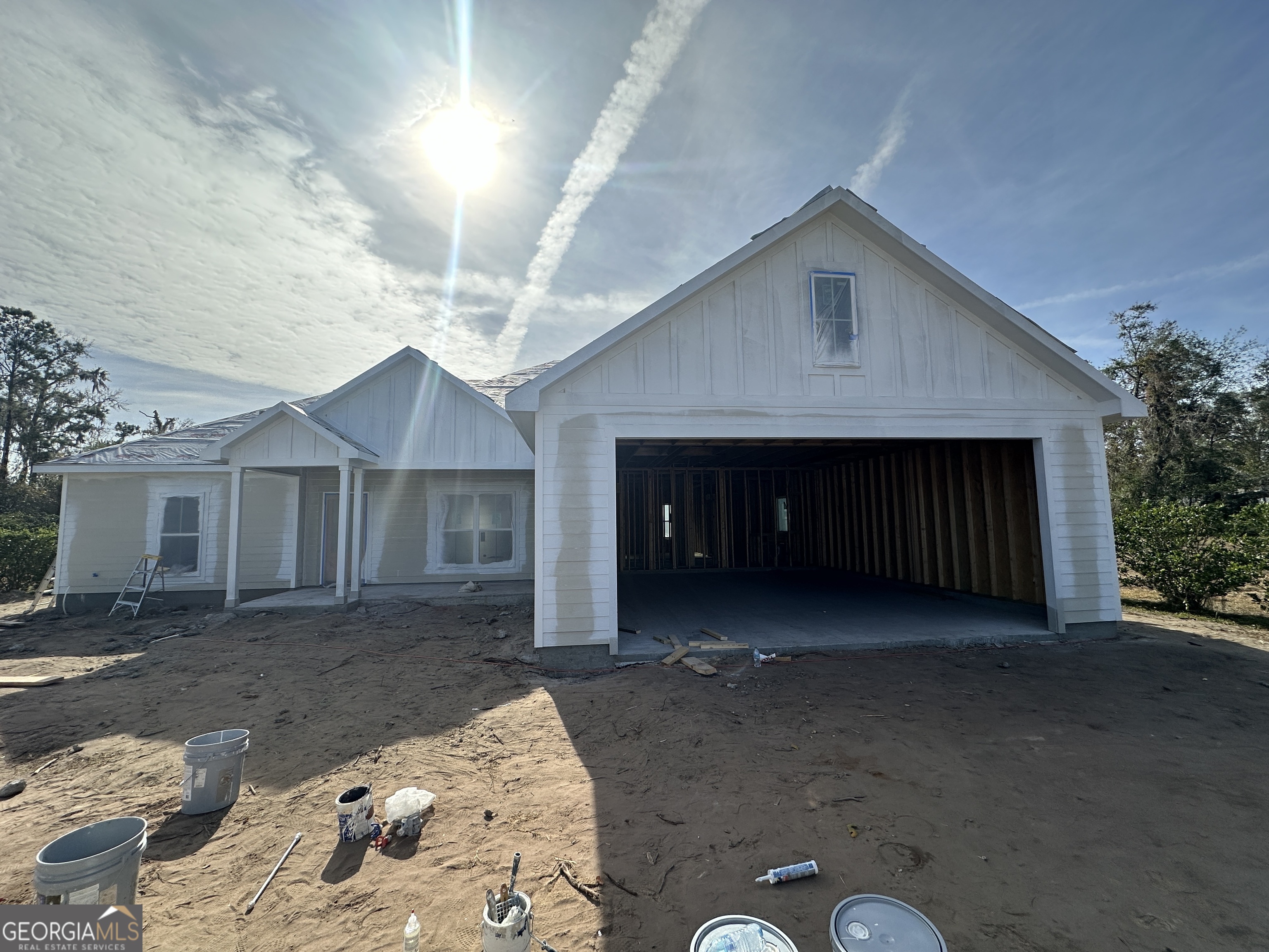 a view of a house with a yard and garage