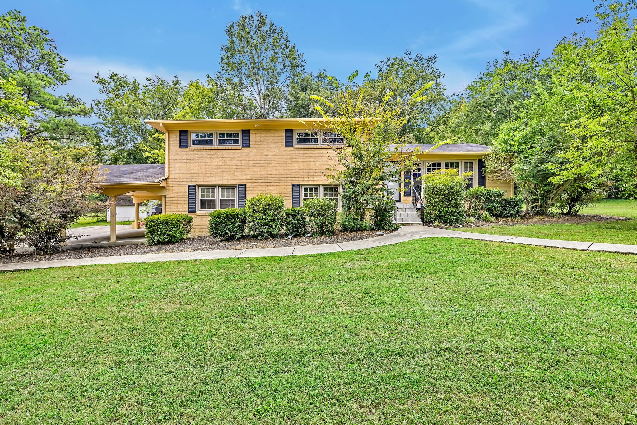 a front view of a house with a yard