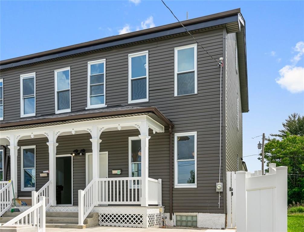 a front view of a house with a porch