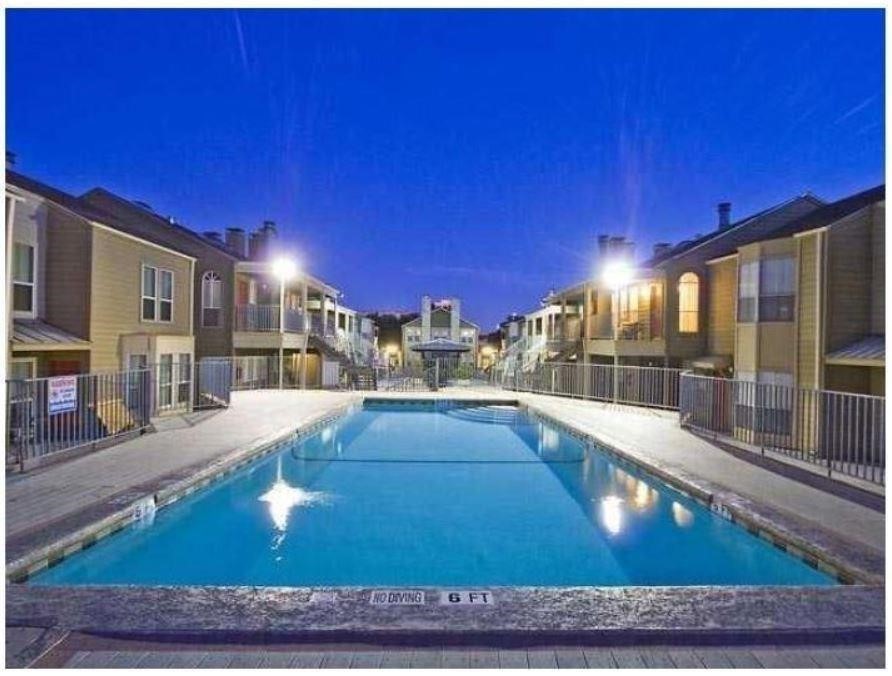 a view of swimming pool with outdoor seating