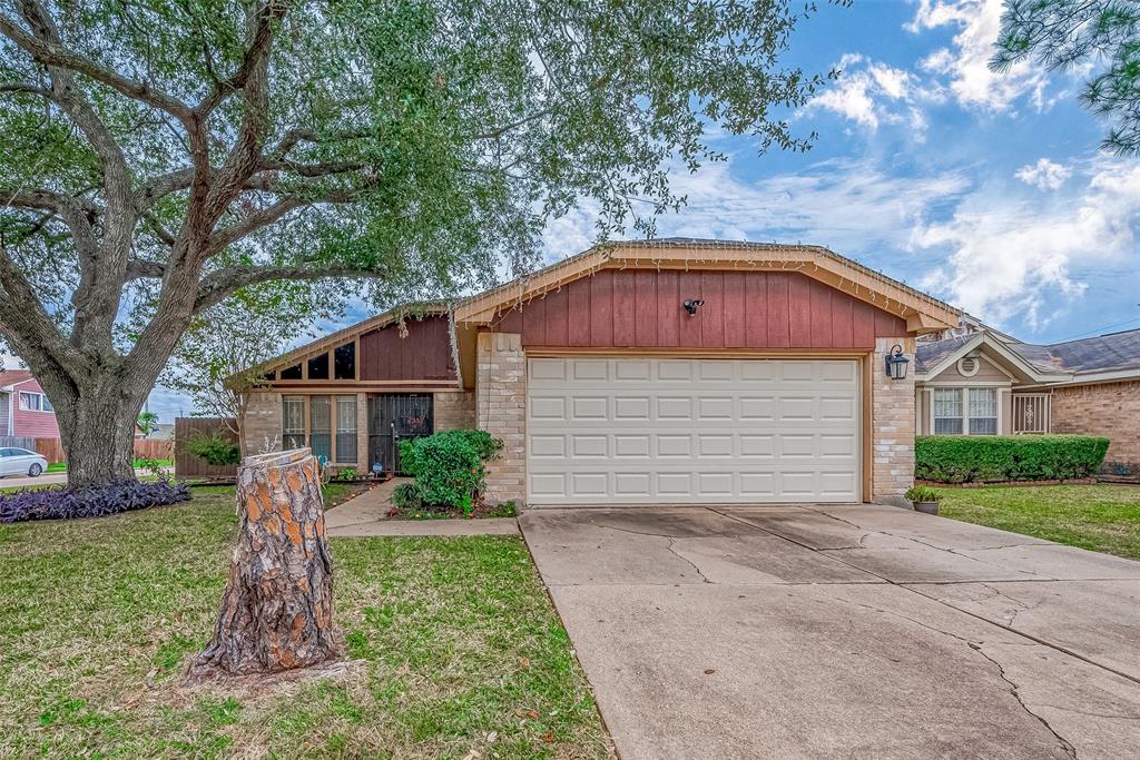 Welcome to this charming single-story home on a corner lot, featuring a spacious driveway and a beautifully maintained lawn. The brick and wood exterior creates a warm, inviting curb appeal.