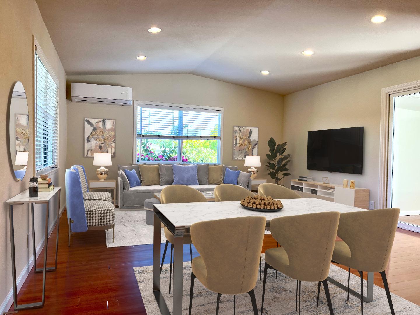 a view of a dining room with furniture window and wooden floor