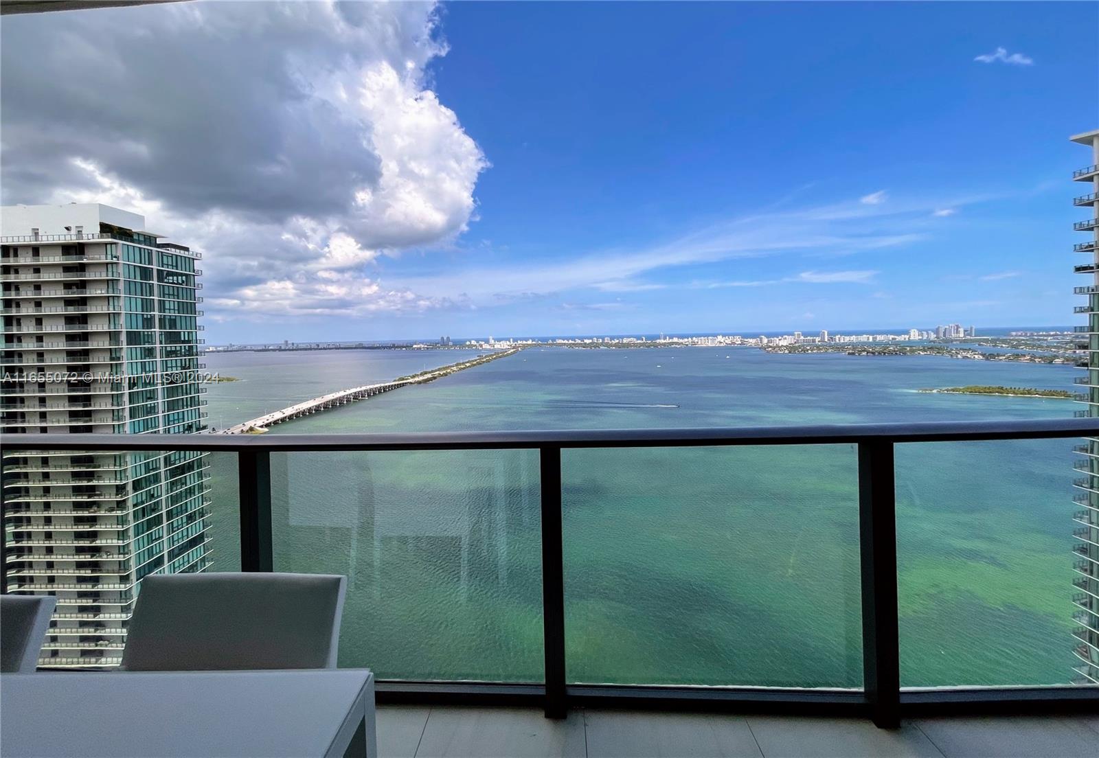 a view of balcony with furniture