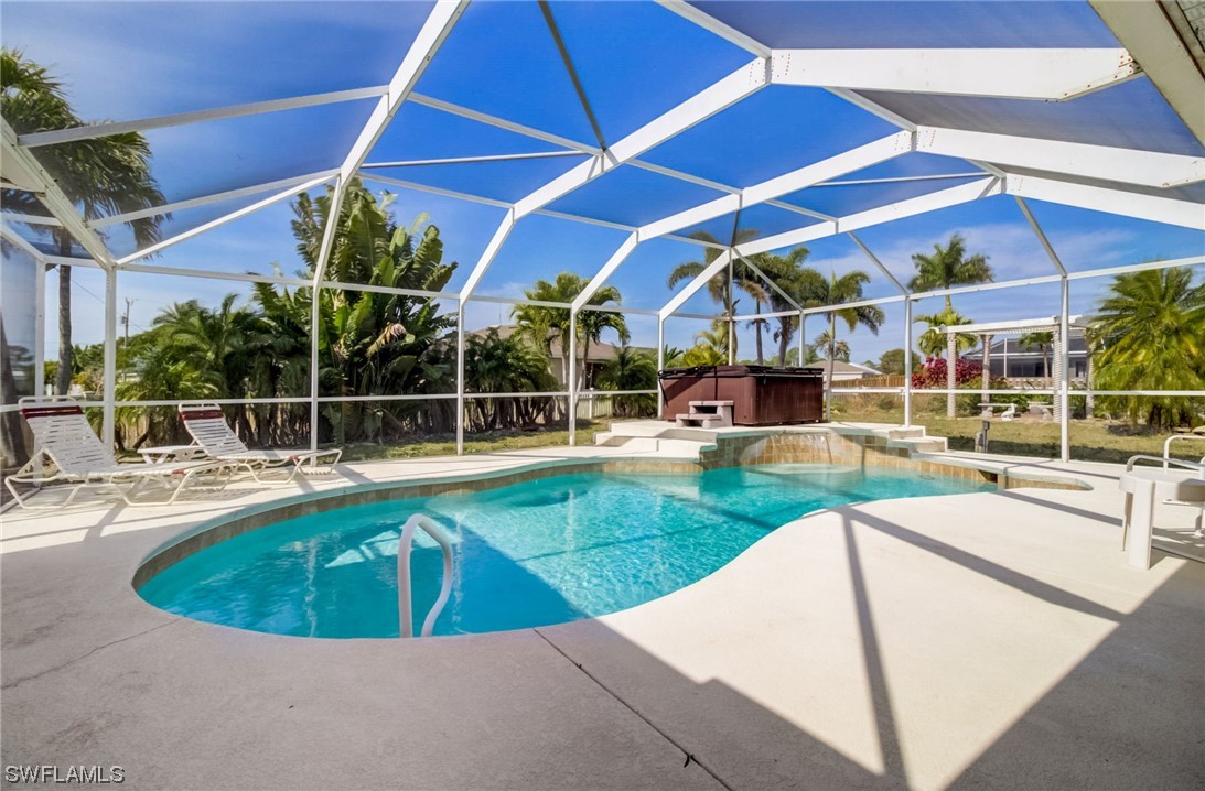 a view of a swimming pool with sitting area