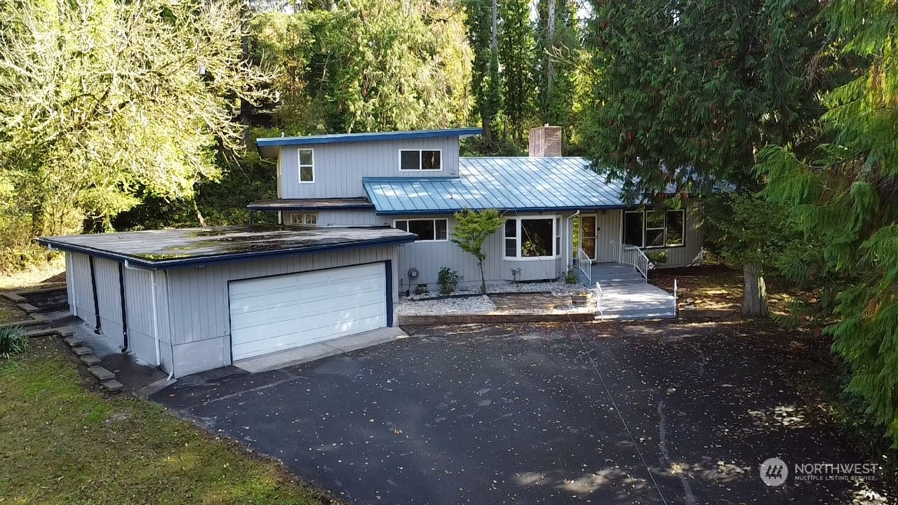 a front view of a house with garage