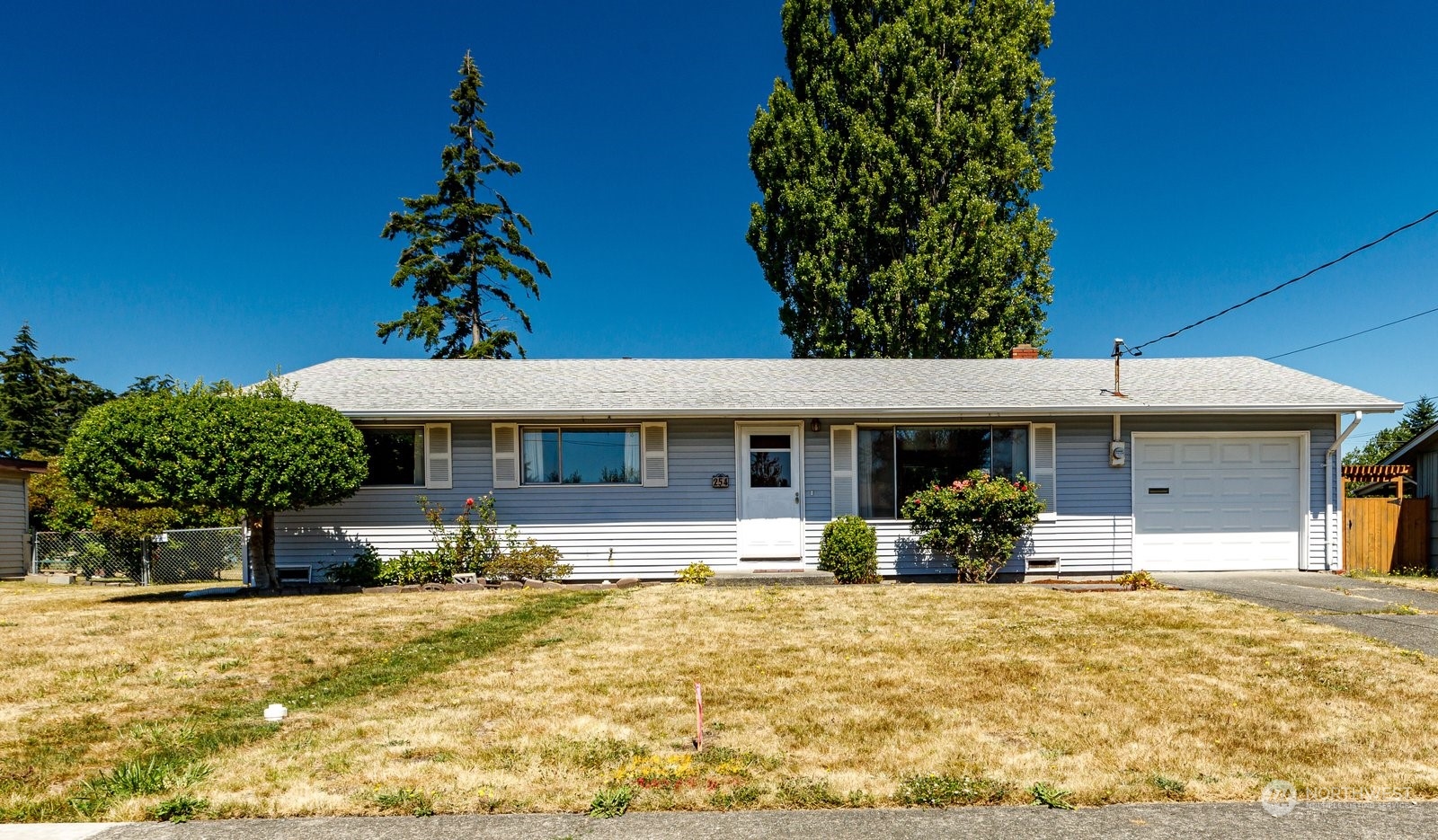 front view of a house with a yard